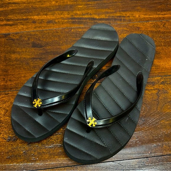 Tory Burch Shoes - Tory Burch Kira Flip Flop size 10 in black with gold logo